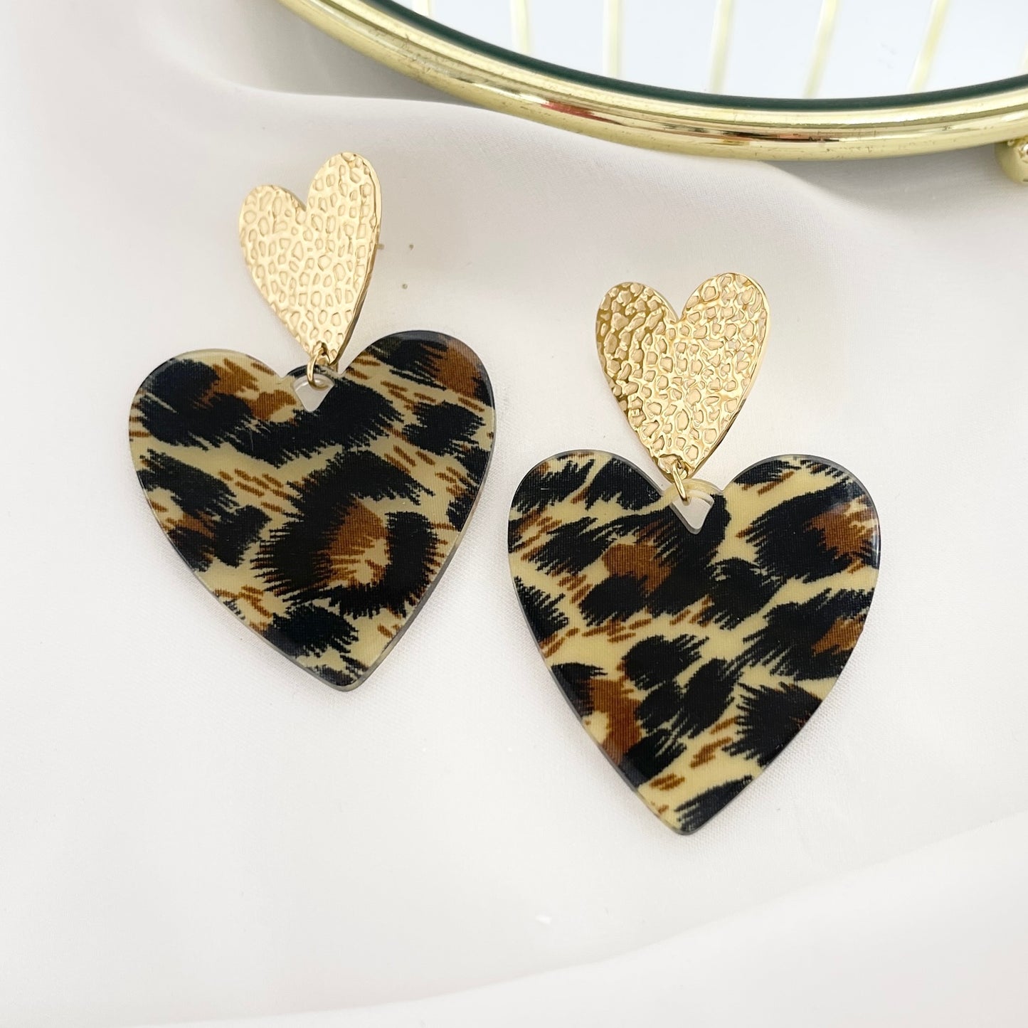 Orecchini cuore maculato